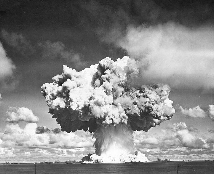 Operation_Crossroads_Baker.jpg - The Wilson cloud has evaporated revealing the cauliflower atop the spray column. Two million tons of water spray fall back into the lagoon. The radioactive base surge is moving toward the ships.