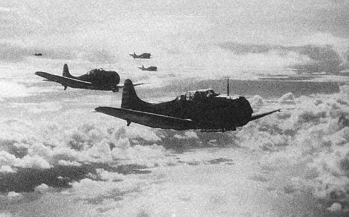 YorktownTulagiSBD.jpg - Yorktown SBD aircraft return to their carrier after striking Japanese shipping in Tulagi harbour.