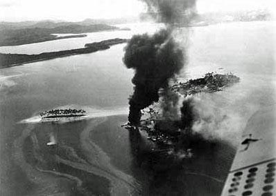 tanambogo-and-ghavutu.jpg - An aerial photograph of Tanambogo Island under attack. Ghavutu Island is located right, above smaller smoke plume.