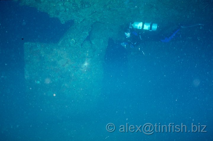 Rudder.jpg - Stern is deeper than the bow. Marion looking at the rudder