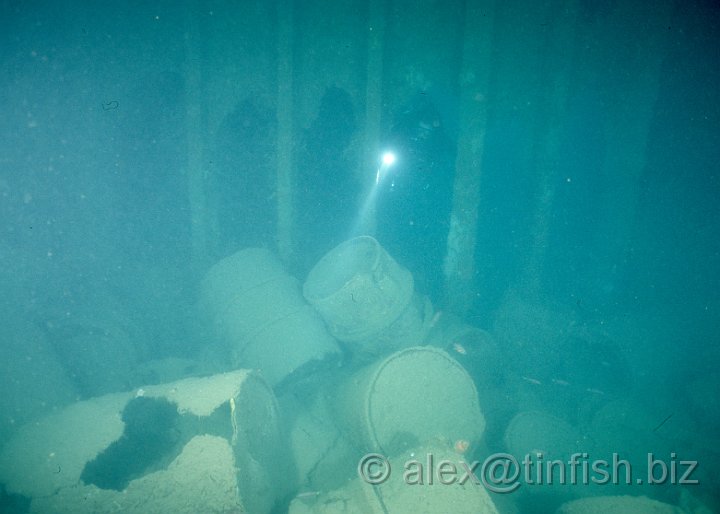 Scan581.jpg - Oil drums inside a hold on the Olympia Maru