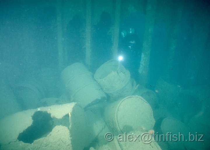 Scan582.jpg - Oil drums inside a hold on the Olympia Maru